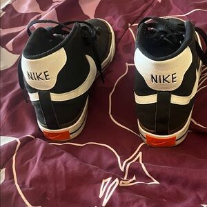 Nike Women’s Black and White Sneakers with Orange Accents
